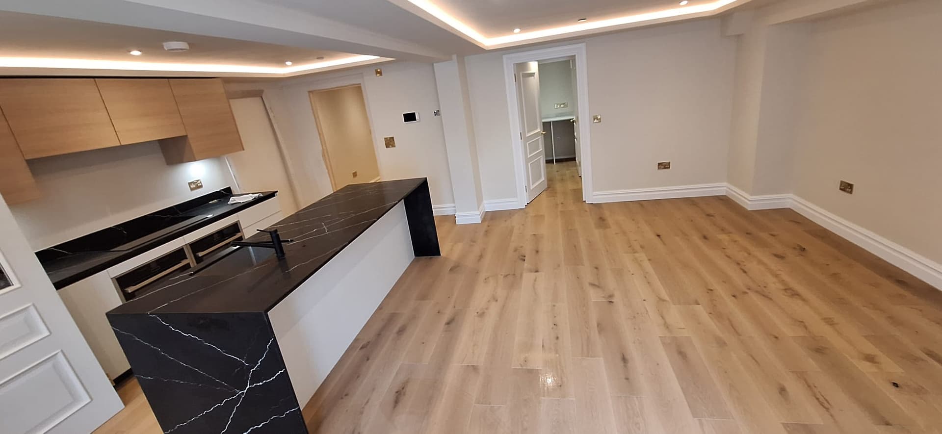 A finished open plan kitchen by Dehari Construction in the Southampton area